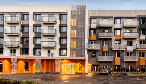Facade of a modern five-storey apartment building.