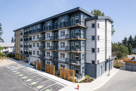Multi shades of grey and white coloured 5 storey apartment building
