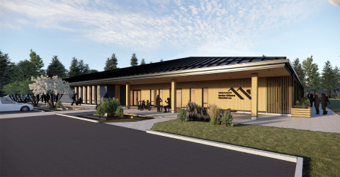 Rendering of modern single-storey building with a sloping roof surrounded by trees and shrubbery. Spacious parking area shown in foreground.