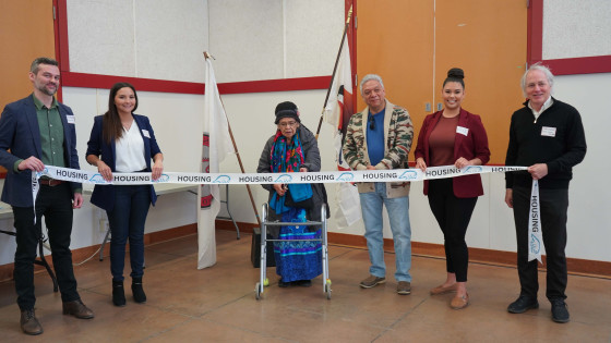 From left to right: Tyler Baker, BC Housing Director of Regional Development; Martina Lewis, OKIB Housing Officer; OKIB Elder Virginia Gregoire; OKIB Chief Byron Louis; Jolene Vincent, OKIB Director of Public Works and Housing; and Craig Crawford, Project Consultant.
