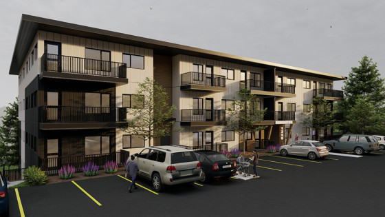 Rendering of a three-storey apartment building’s exterior with adjacent outdoor parking.