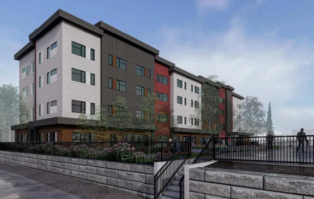 Design for a modern apartment building with trees, plants, and a sidewalk in front.